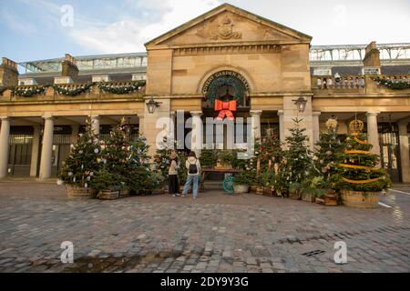 London, UK. 24th Dec, 2020. Decorations of Christmas trees seen in Covent garden during Christmas Eve 2020. Credit: SOPA Images Limited/Alamy Live News Stock Photo