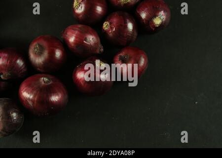 sweet red onions on background Stock Photo