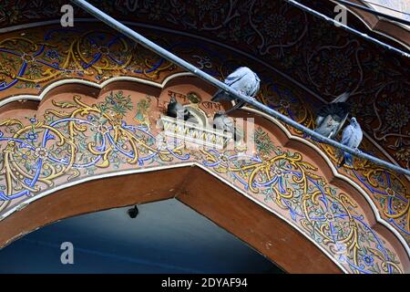 Jaipur, Rajasthan, India - November, 2016: Ornate colorful pattern close-up on the arch of palace gate in Pink city Stock Photo