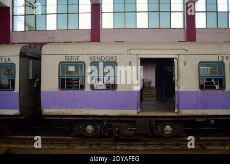 Suburban local train on the railway station. City metro vendors with open doors. Chennai, India Stock Photo