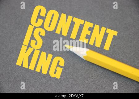 Content is king written on blackboard with yelllow pencil. Search Engine Optimization business concept. Stock Photo