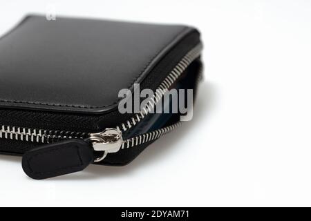 Closeup mens wallet black leather zipper pouch isolated on white background Stock Photo