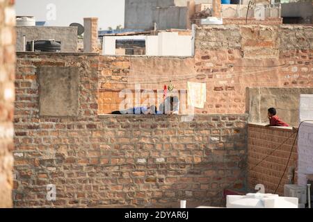 Some children are playing on the roof during the Covid-19 lockdown in India. Stock Photo