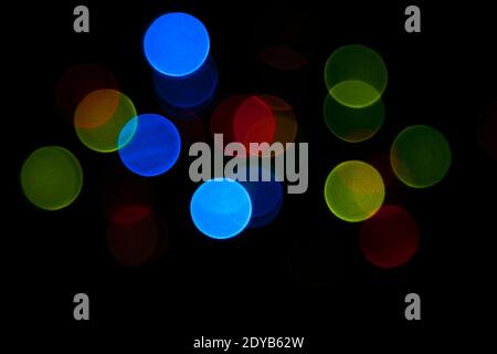 Colorful bokeh lights texture on a dark background Stock Photo