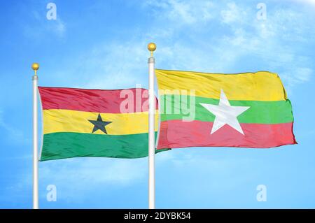 Ghana and Myanmar two flags on flagpoles and blue sky Stock Photo