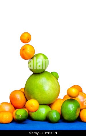 Falling tower of citruses, oranges, pomelo, limes, tangerines and grapefruits isolated on white background Stock Photo