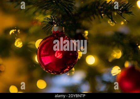 Christmas decorations and lights, Christmas tree balls, angels, stars and candles on the Christmas tree Stock Photo