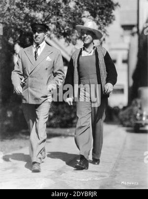 Director RAUL WALSH and BING CROSBY candid on MGM Studio Lot during filming of GOING HOLLYWOOD 1933 director RAOUL WALSH story Frances Marion screenplay Donald Ogden Stewart producer Walter Wanger Cosmopolitan Productions / Metro Goldwyn Mayer Stock Photo