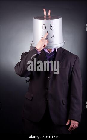 funny businessman with a bucket on his head Stock Photo