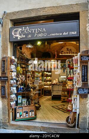 Exterior and entrance of a wine shop in the old town of Volterra selling Tuscan wines and local products, Pisa, Tuscany, Italy Stock Photo