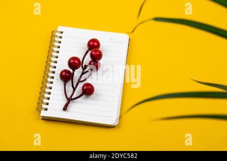Workplace with a beautiful notepad and a houseplant, concept and composition of a desktop photo Stock Photo