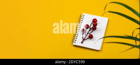 Workplace with a beautiful notepad and a houseplant, concept and composition of a desktop, banner photo Stock Photo