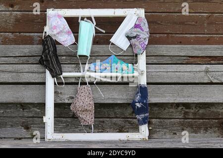 Various purchased and self-sewn protective masks, or makeshift masks against the corona virus Stock Photo