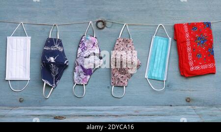 Various purchased and self-sewn protective masks, or makeshift masks against the corona virus Stock Photo