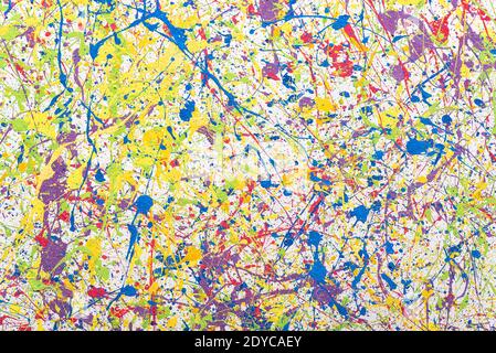 Background with multi-colored splashes of paint on the wall. Colored. Stock Photo