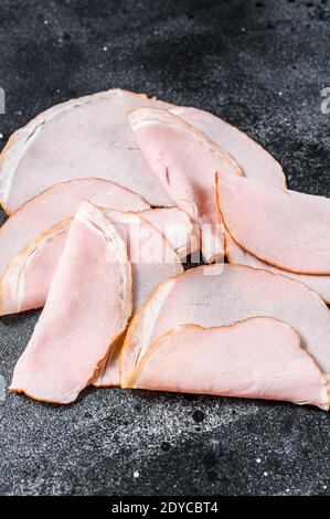 Slices of pork pastrami. Organic meat. Black background. Top view Stock Photo