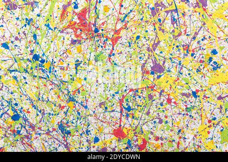 Wall with multi-colored paint splashes. Bright abstract background. Stock Photo