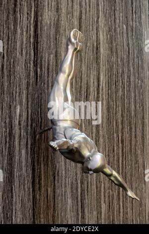 Human waterfall, male diver, vertical, Dubai Shopping Center, Dubai, UAE Stock Photo