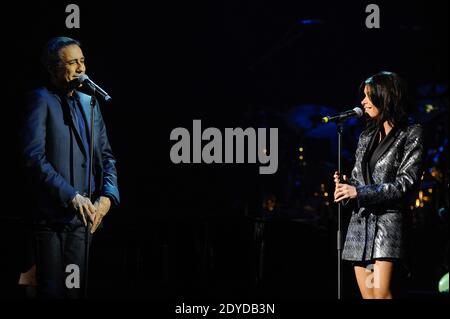 French singer Alain Chamfort performs live on stage with Jenifer and his band at the Grand Rex, in Paris, France, on January 30, 2013. Photo by Christophe Guibbaud/ABACAPRESS.COM Stock Photo