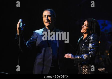 French singer Alain Chamfort performs live on stage with Jenifer and his band at the Grand Rex, in Paris, France, on January 30, 2013. Photo by Christophe Guibbaud/ABACAPRESS.COM Stock Photo