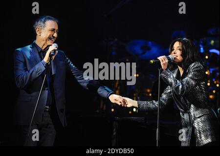 French singer Alain Chamfort performs live on stage with Jenifer and his band at the Grand Rex, in Paris, France, on January 30, 2013. Photo by Christophe Guibbaud/ABACAPRESS.COM Stock Photo