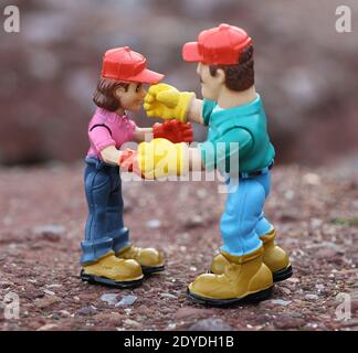 Simulated workplace fight using toy figures Stock Photo