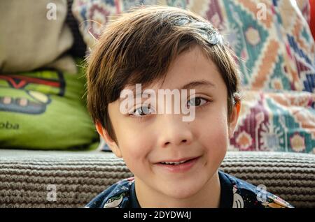 Portrait of a handsome young boy with brown hair and brown eyes, Stock Photo