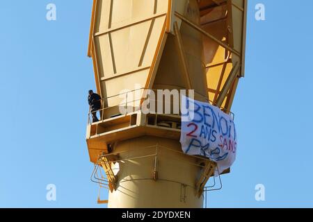 Serge Charnay stands on a giant crane disused on February 17, 2013 in Nantes on the third day of a protest for his rights as a father. He paints the message ' Save out children from the justice'. Photo by Laetitia Notarianni/ABACAPRESS.COM Stock Photo