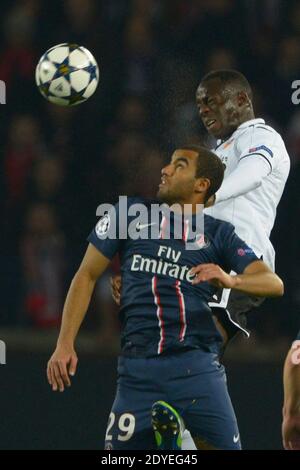 PSG's Lucas Moura battling Valence's Aly Cissokho during the Champion's League 1/8 final soccer match, Paris-St-Germain vs Valence in Paris, France, on March 6th, 2013. PSG and Valence drew 1-1 but PSG qualifies for the 1/4 Finals. Photo by Henri Szwarc/ABACAPRESS.COM Stock Photo