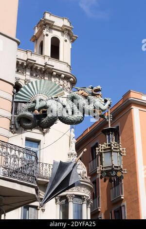 Chinese Dragon Sculpture holding lamp on the  corner of the Casa Bruno Cuadros building Stock Photo