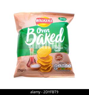 SWINDON, UK - DECEMBER 26, 2020: Bags of Walkers New Recipe Oven Baked Salt and Vinegar Flavour crisps, isolated on a white background. Walkers is a B Stock Photo