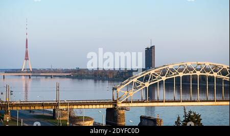 Aerial view of Riga city - capital of Latvia. Amazing view on the river Daugava, bridge over the river and the main TV tower. Stock Photo