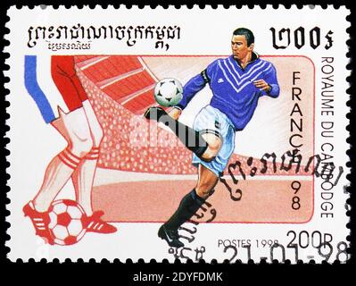 MOSCOW, RUSSIA - MAY 25, 2019: Postage stamp printed in Cambodia shows Soccer players, World Cup Football serie, circa 1998 Stock Photo