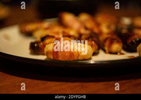 Pigs in blankets on a plate Stock Photo