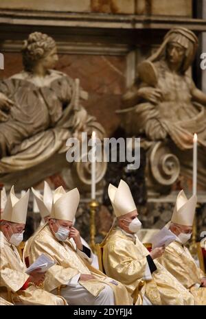 Cardinals attend the Christmas Eve Mass presided over by Pope Francis ...