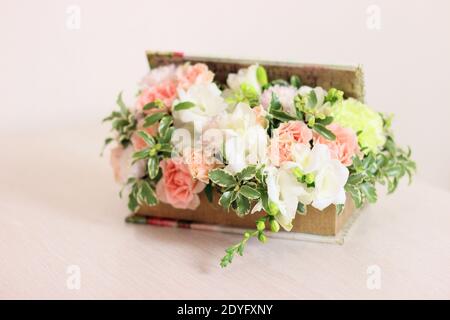 Fragrant Flower Box. The composition of the composition includes peach roses, white freesia, pale green dianthus, chrysanthemum and fluffy greens. Gif Stock Photo
