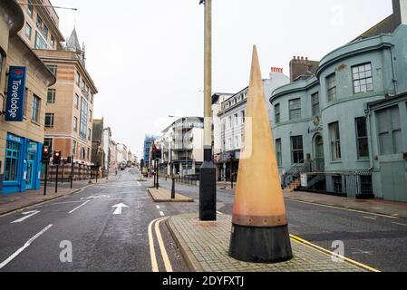 Brighton UK 26th December 2020 - West Street in Brighton is quiet on Boxing Day as the whole of Sussex went into Tier 4 last night at midnight . The new coronavirus COVID-19 restrictions are affecting millions of people in the South and South East of Britain : Credit Simon Dack / Alamy Live News Stock Photo