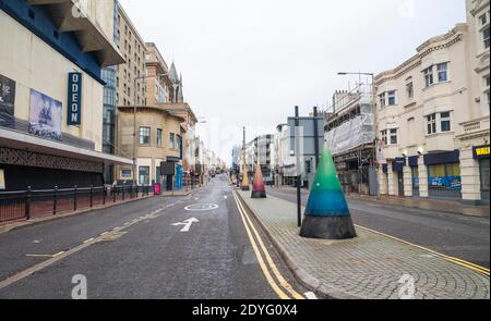 Brighton UK 26th December 2020 - West Street in Brighton is quiet on Boxing Day as the whole of Sussex went into Tier 4 last night at midnight . The new coronavirus COVID-19 restrictions are affecting millions of people in the South and South East of Britain : Credit Simon Dack / Alamy Live News Stock Photo