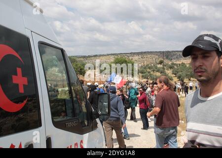 A Palestine Red Crescent Society ambulance is parked outside a hospital ...