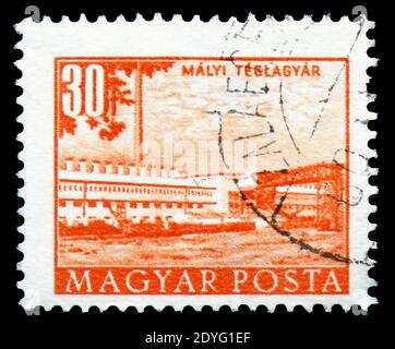 MOSCOW, RUSSIA - JULY 19, 2019: Postage stamp printed in Hungary shows Brick factory, Maly, Buildings of the Five-Year-Plan in Budapest serie, circa 1 Stock Photo