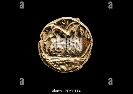 Ancient British Gold Stater coin of Catuvellauni BC45-20 replica reverse side showing a horse cut out and isolated on a black background, photo Stock Photo