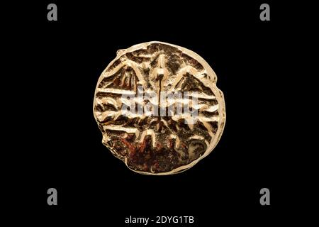 Gold Stater coin of Catuvellauni BC45-20 replica obverse side showing a decaying wreath cut out and isolated on a black background, stock photo image Stock Photo