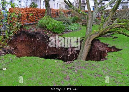 Bristol, UK. 26th Dec, 2020. UK Bristol. Canynge Square in Clifton Village A Large Sinkhole with tree in it opens up in residents private garden. Picture Credit: Robert Timoney/Alamy Live News Stock Photo