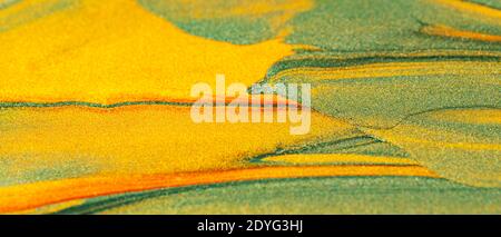 Green orange giltter texture. Decorative multicolored background with sparkles. Abstract background with copy space Stock Photo