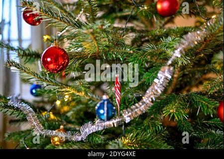 christmas tree full with colorful and decorative balls Stock Photo