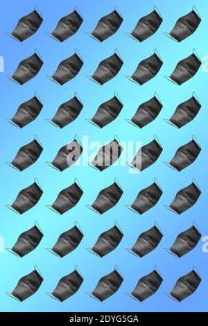 Protective mask pattern. Face protective masks pattern isolated on gradient background. Many black medical masks on the multicolored background. Medic Stock Photo