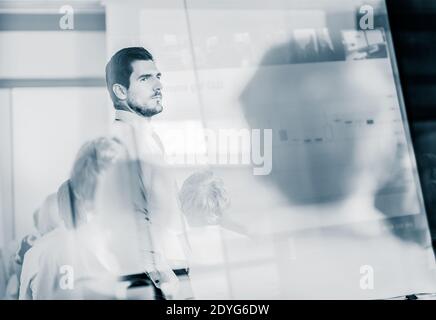 Team leader making presentation on corporate business meeting. Stock Photo