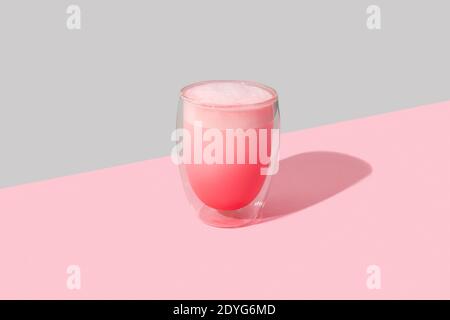 Pink rose milkshake in a transparent glass. Matcha latte template for restaurant in a minimal style. Stock Photo