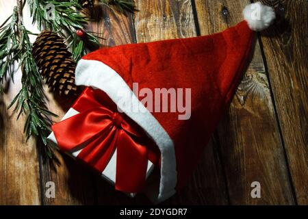 Christmas gift with Santa hat. Christmas background. Stock Photo