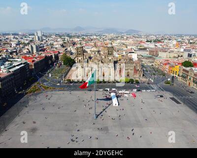 Mexico National Flag on Zocalo Constitution Square and Metropolitan Cathedral aerial view, Mexico City CDMX, Mexico. Historic center of Mexico City is Stock Photo